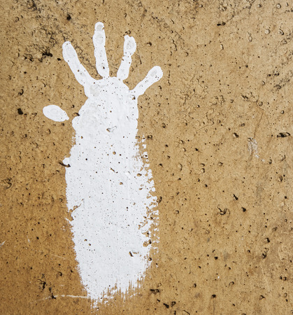 white imprints of human hands on wall concreteの写真素材