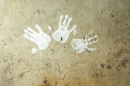 white imprints of human hands on wall concreteの写真素材