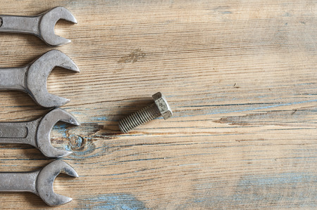 wrenches on wood plank background with copy space.の写真素材