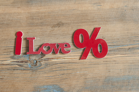 inscription I love percent top view on a wooden tableの写真素材