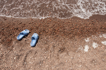 flip flops sandal on beach and sea wave.Summer holiday.の写真素材