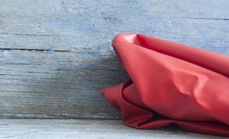 red leather surface texture closeup border wooden .Useful as background for design-works. Top viewの写真素材