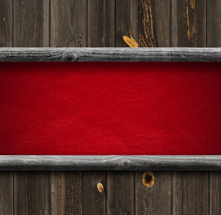 leather background framed by old wooden planksの写真素材