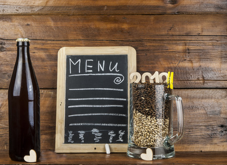 Glasses filled with different malts over a wooden background.の写真素材