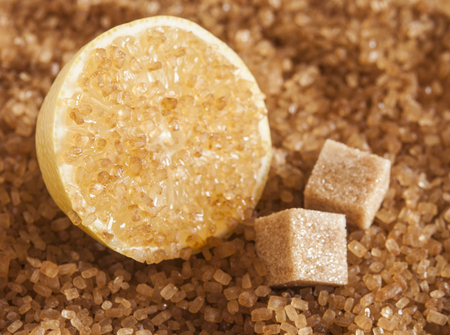 Brown sugar with slice of lemonの写真素材