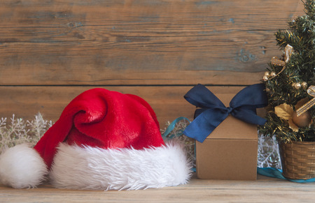Christmas tree with decorations and presents on wooden table backgroundの写真素材