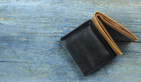 leather wallet on wooden background. Top view.の写真素材