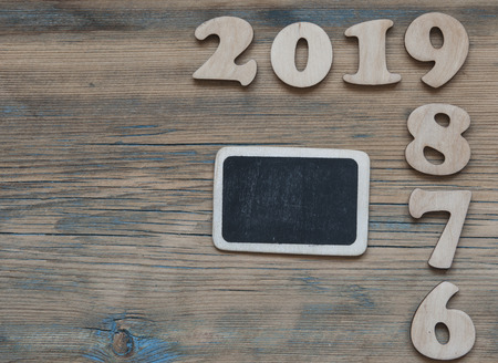 New years resolution 2019 concept. Wooden year number on table with copy space for your text