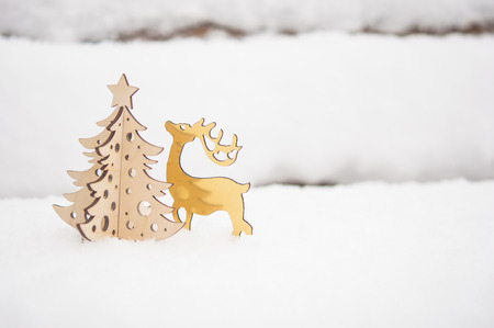 Merry Christmas postcard background - Miniature christmas tree in snowy winter forestの写真素材
