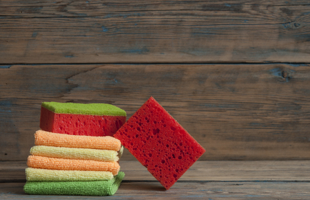 Cleaning day concept with supplies over wooden backgroundの写真素材