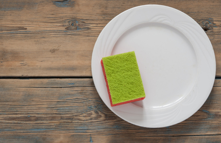 Cleaning day concept with supplies over wooden backgroundの写真素材