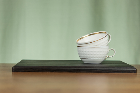 a stack of cups on a wooden table. Copy spaceの写真素材
