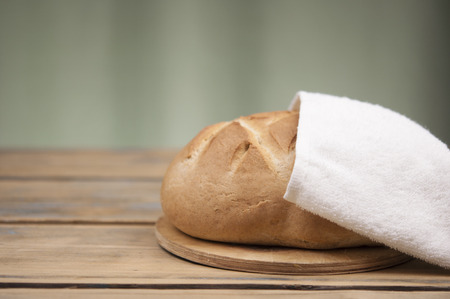 freshly baked sliced bread on wooden table