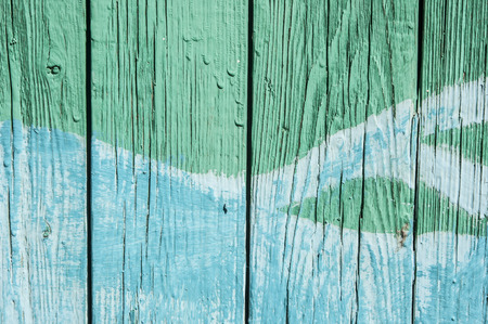 Old painted wood planks texture with flaked paintの写真素材