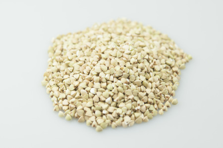 Sprouts of green buckwheat on white background. Macro shot raw organic buckwheat plant. Vegan germinated sprouts, vegetarian cuisine. Healthy diet buckwheat porridge food.の写真素材