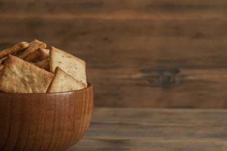 Many small dried rusks bread loaf toast biscuits as texture background. Diet food healthy nutritionの写真素材
