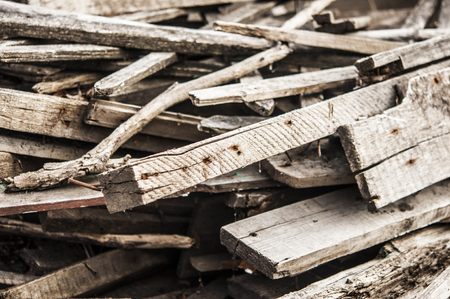 pile of boards after the reconstruction of the building. broken boards with nails. Old boards. Backgroundの写真素材