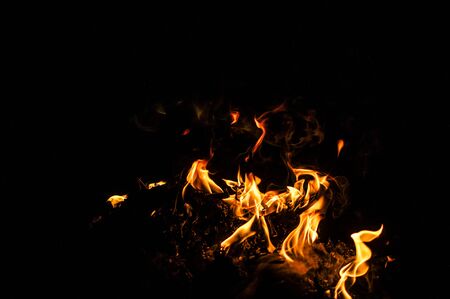 red flames of fire over black backgorund