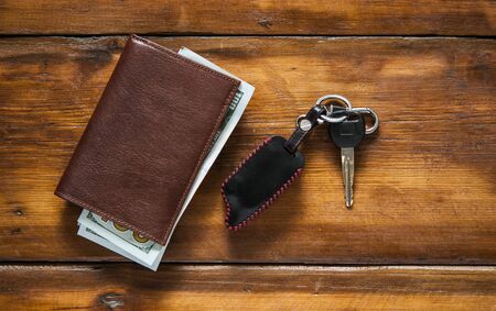 Travel Holiday with car keys and wallet on the wooden table. copy space.の写真素材