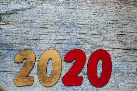 New year concept - Number 2020 for New Year and decoration on a wooden table. With vintage styled background.の写真素材