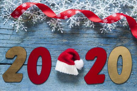 New year concept - Number 2020 for New Year and decoration on a wooden table. With vintage styled background.の写真素材