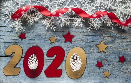 New year concept - Number 2020 for New Year and decoration on a wooden table. With vintage styled background.の写真素材
