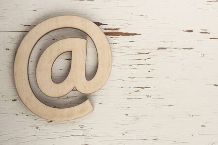 Email symbol on wooden background concept for internet, contact and e-mail addressの写真素材