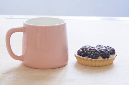 fruit tartlet on the wooden table, fruit baked shell, fruit cupcake with berry