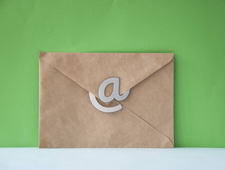 E-mail symbol on brown business lettersの写真素材
