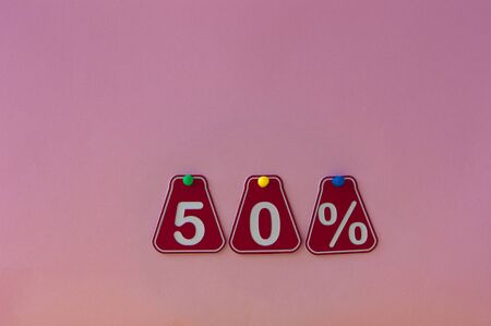 selling 50 percent. Big sale 50%, fifty percent on pink background for flyer, poster, shopping, sign, discount, marketing, sale, banner, website, headlineの写真素材