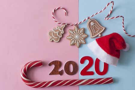 Colorful candy lollipops Christmas candy on blue and pink  background. 2020 Happy new year