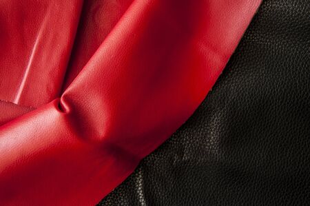 Close up background of black and red natural leather grain, high angle diagonal viewの写真素材