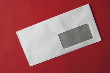 envelopes on red table top view. Mockup for business mail, blogging and office correspondence. Flat...