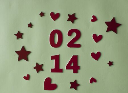 Love word, heart and stars on soft blue paper  background. Top view. Valentines day, holiday.