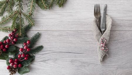 2020 New year concept.  fork and knife on wooden tabletop. Top view, copy space, Table setting. background for menu, layoutの写真素材