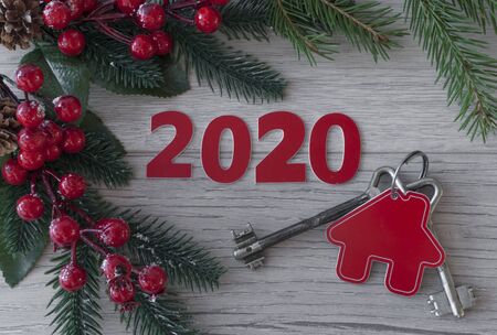 Beautiful Christmas background: decorative house and key to the lock. Concept of finance and housing loans. Top viewの写真素材