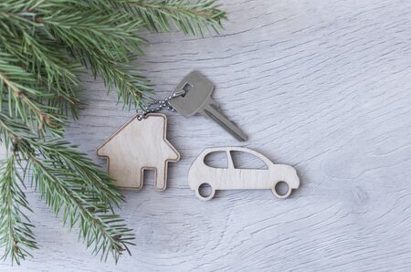 Beautiful Christmas background: decorative house and key to the lock. Concept of finance and housing...