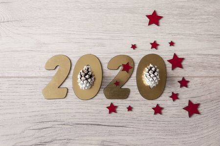 New Year's composition. Christmas tree branches with berries on a wooden background.  New 2020 year concept. Flat lay. Top viewの写真素材