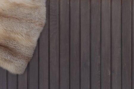 Textures red fox fur. Red fox shaggy fur texture cloth abstract, furry rusty texture plain surface on wooden background. Top view. の写真素材