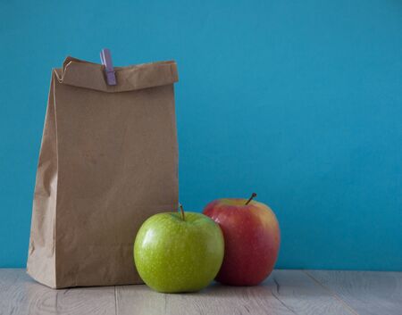 brown paper breakfast bag and mixed fruit. School lunchの写真素材