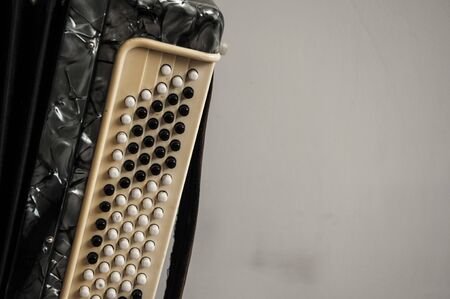 Fragment of classical retro bayan (accordion), musical instrument 