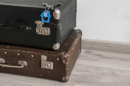 rustic leather vintage suitcases and old two keys with sign home sweet home. welcome homeの写真素材