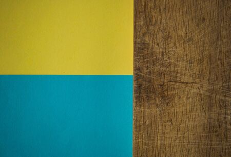 wooden background on colorful paper. Copy space, mockup for your design, text.の写真素材