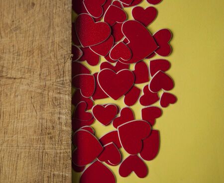 Valentine's Day card. Red hearts on wooden background. Greeting card concept. Flat lay, top view, copy space. の写真素材