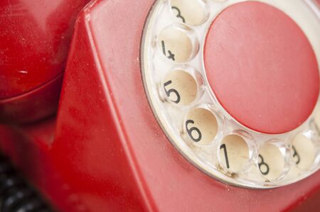 Classic old rotary dial telephone on wood tableの写真素材