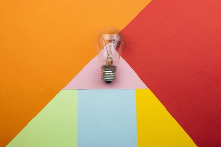 Vintage house key on colorfull paper background concept for real estate, moving home or renting property の写真素材