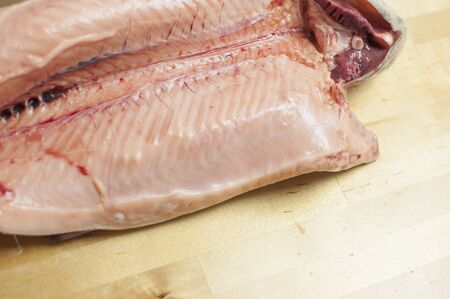Fresh rainbow trout. River fish on wood background