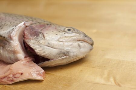 Fresh rainbow trout. River fish on wood background