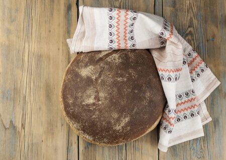 Round loaf of freshly backed sourdough bread, with copy spaceの写真素材