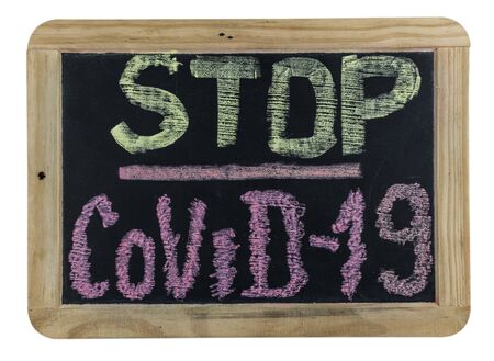 Chalk inscription stop coronavirus covid-19 on blackboard. World pandemic epidemic concept.の写真素材